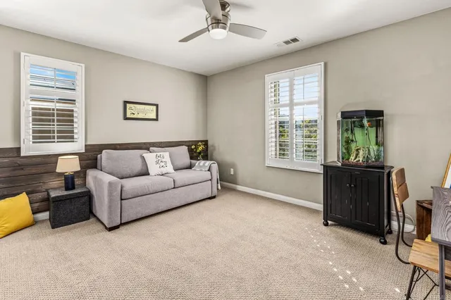 a living room with furniture and a window