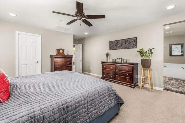 a bedroom with a bed and a television