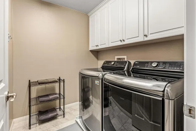 a view of storage and utility room with washer and dryer