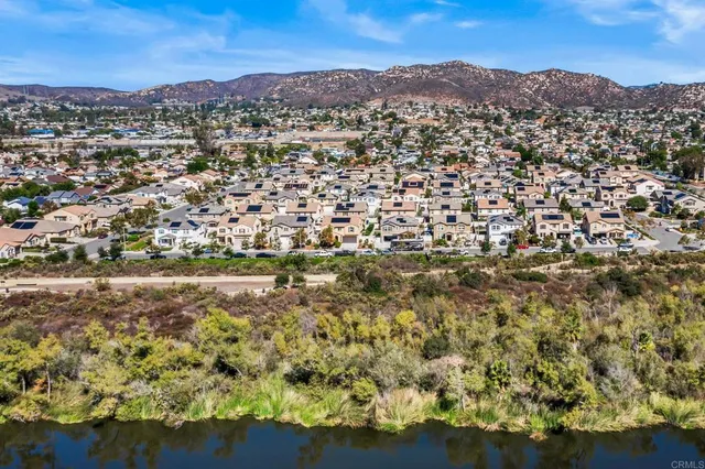 a view of a town with mountains in the background