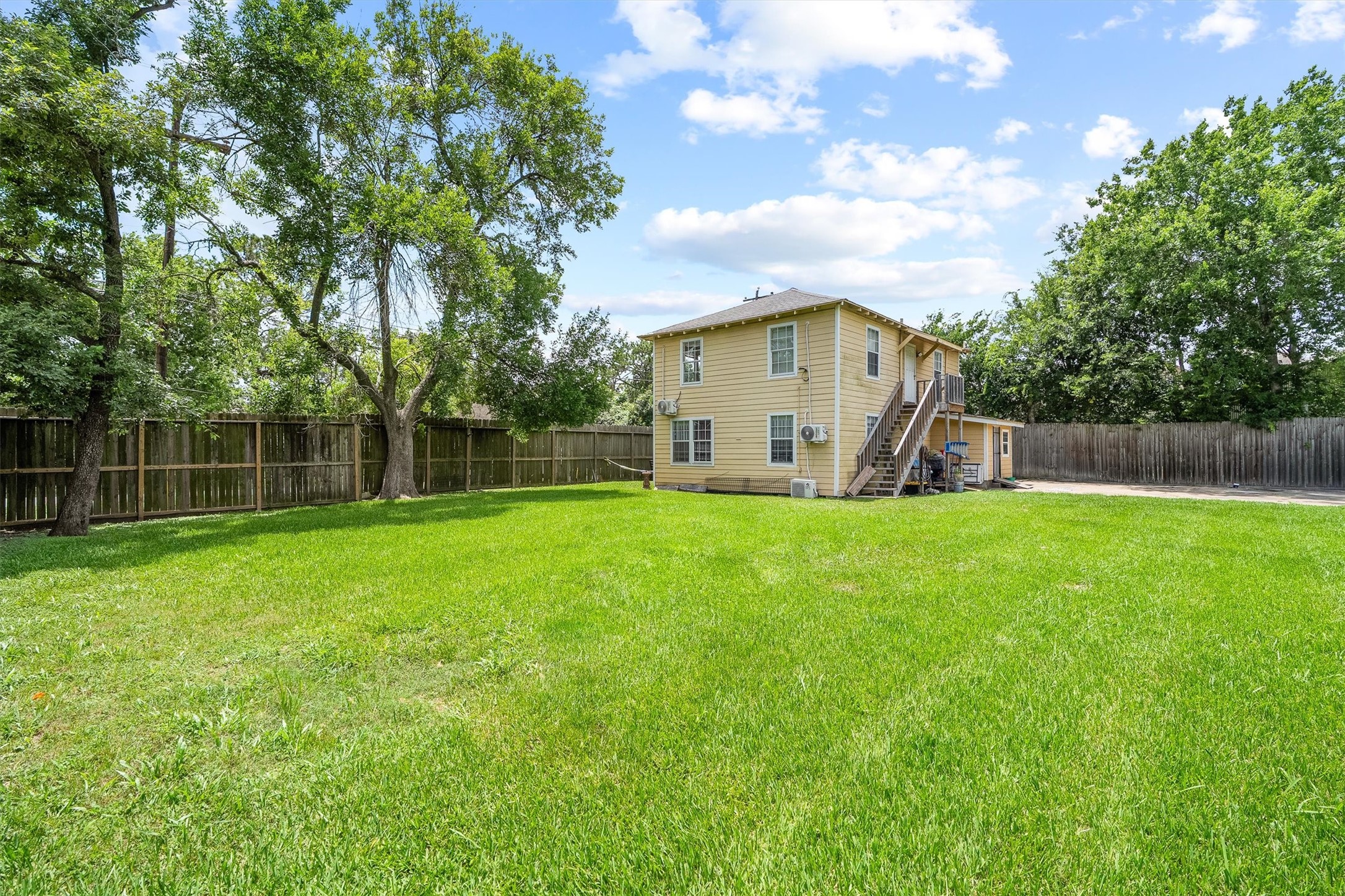 4233 Du Pont Street Houston, TX 77021 - Photo 12 of 14 Enjoy this fenced-in backyard with a well-maintained lawn and mature trees.