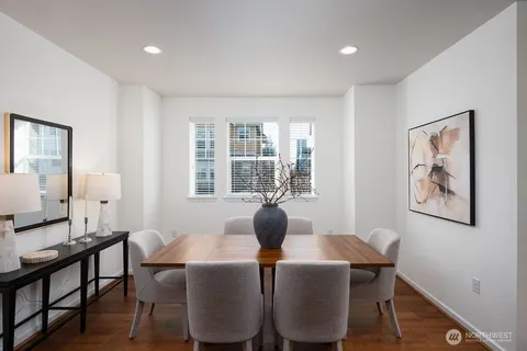 a dining room with furniture and window