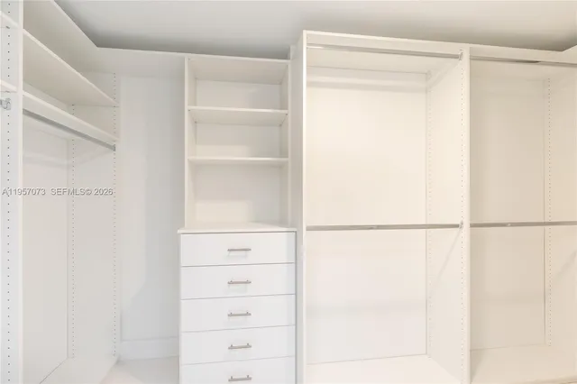 a bedroom with furniture and a fireplace