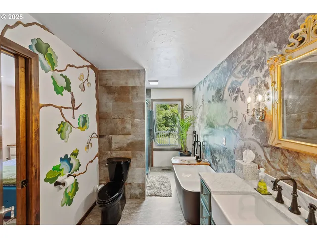 a picture of a bathroom with a bathtub