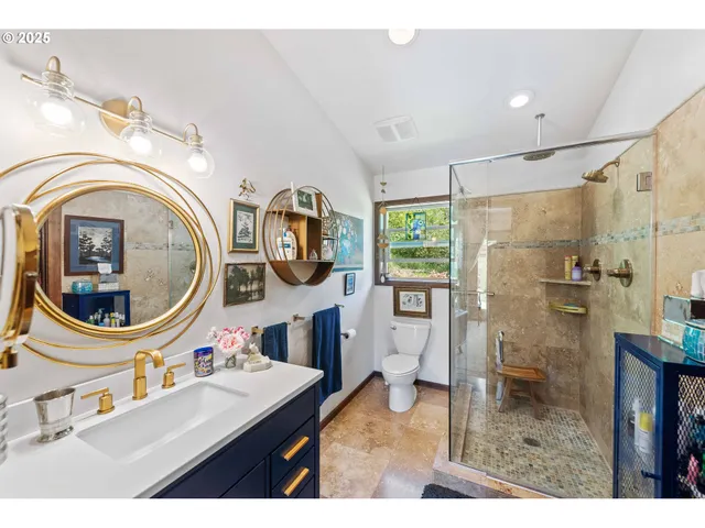 a bed room with a bed a television and a large window