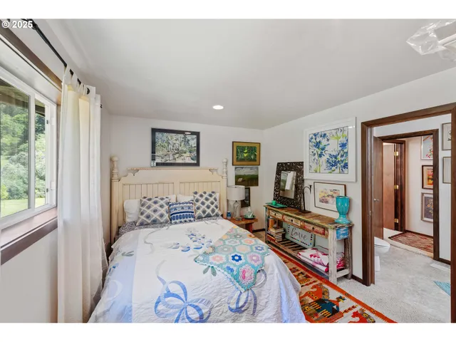 a living room with a hallway and wooden floor