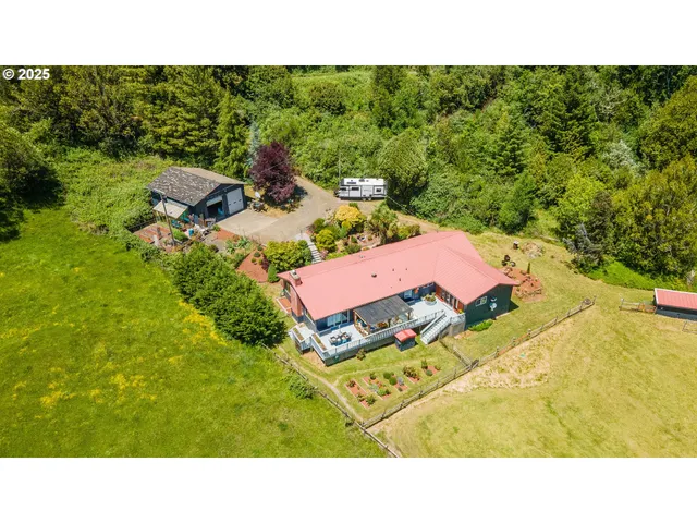 a backyard of a house with a yard and outdoor seating