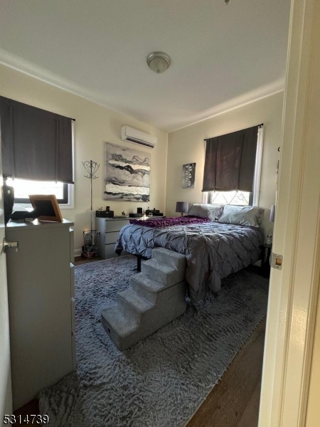 183 Garibaldi Avenue, Unit 207 Lodi, NJ 07644 - Photo 5 of 10 a living room with furniture and a window