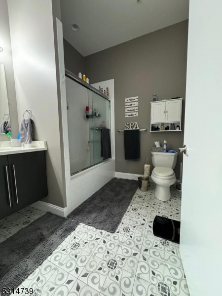 183 Garibaldi Avenue, Unit 207 Lodi, NJ 07644 - Photo 8 of 10 a bathroom with a sink toilet and shower