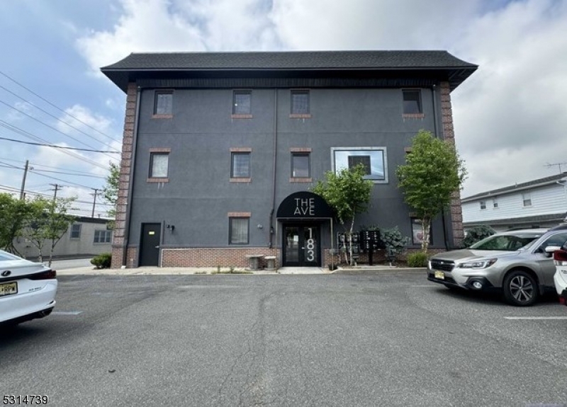 183 Garibaldi Avenue, Unit 207 Lodi, NJ 07644 - Photo 10 of 10 a view of a car parked in front of a building
