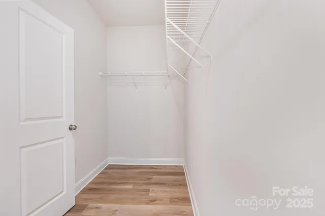 a view of an empty walk in closet