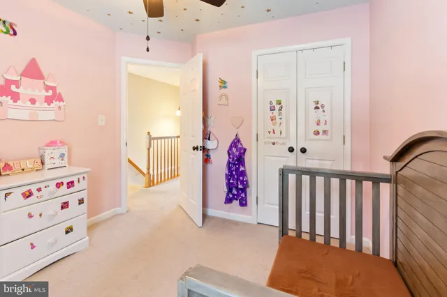 a bedroom with furniture and a chandelier