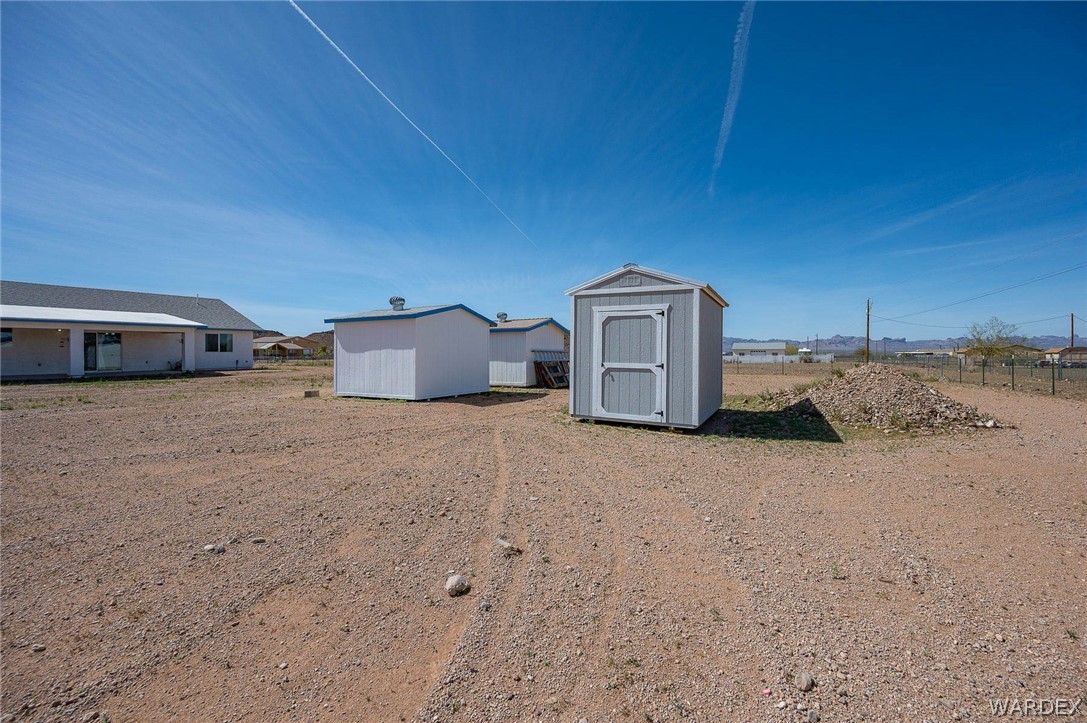 3411 West Carmichael Road Golden Valley, AZ 86413 - Photo 58 of 97 View of yard with a storage unit