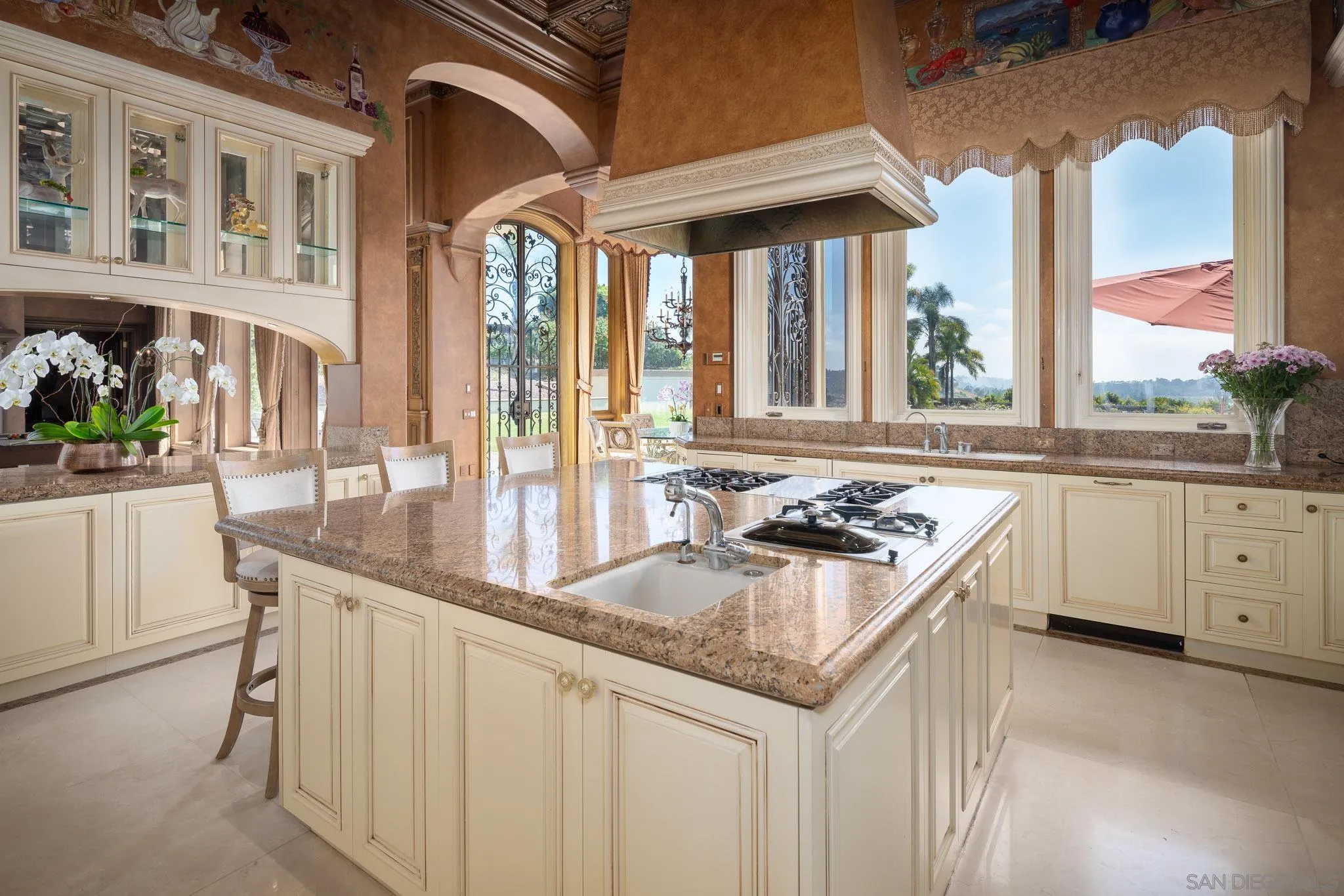 6883 Alydar Corte Del Mar, CA 92014 - Photo 14 of 48 a kitchen with stainless steel appliances granite countertop a stove and a sink
