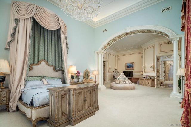 a living room with furniture and flowers