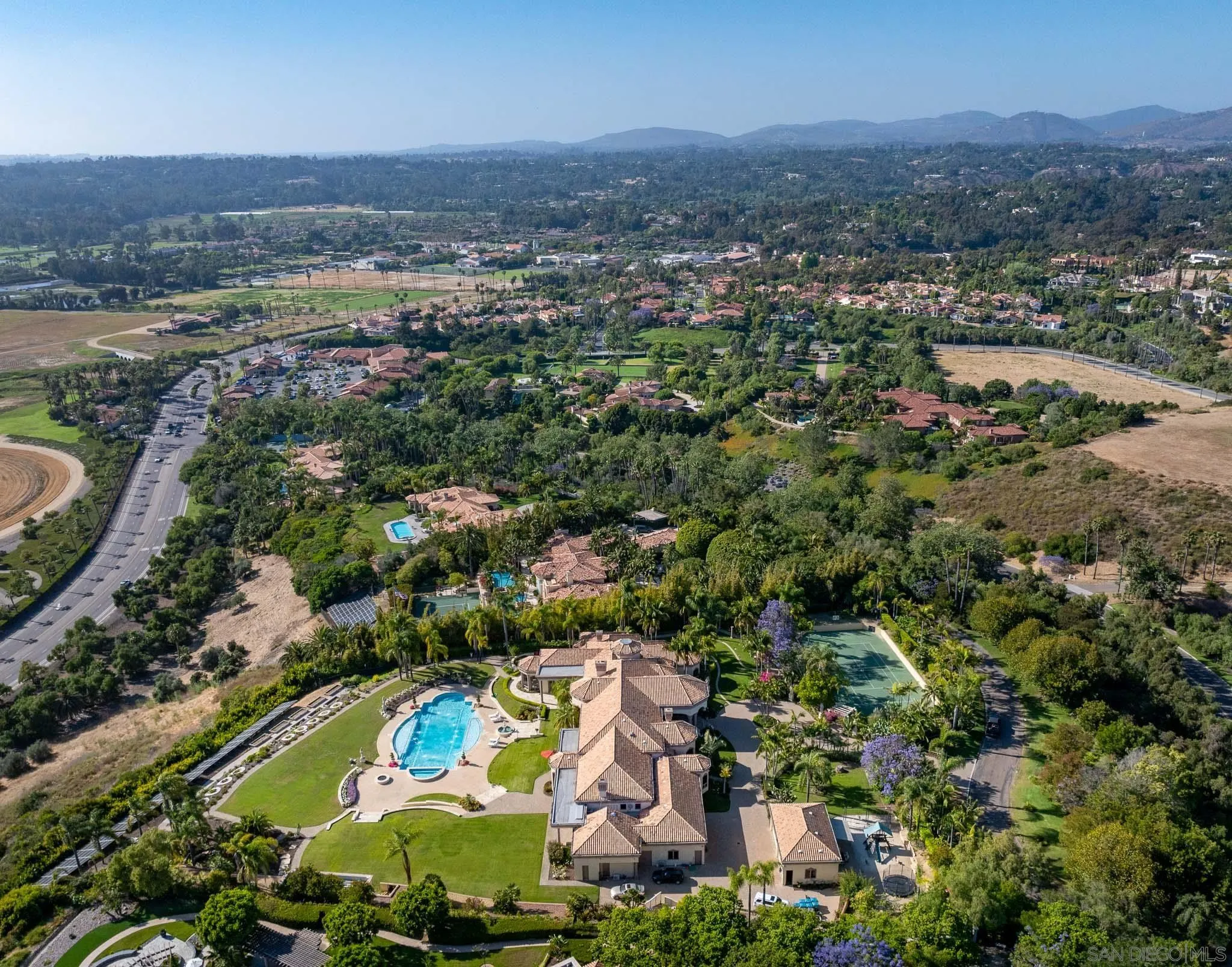 6883 Alydar Corte Del Mar, CA 92014 - Photo 45 of 48 an aerial view of residential houses with outdoor space and trees