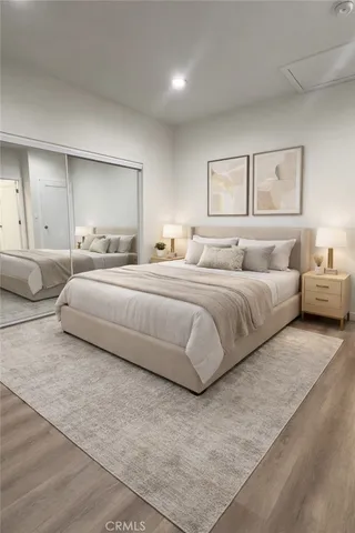 a bedroom with a bed and ceiling fan
