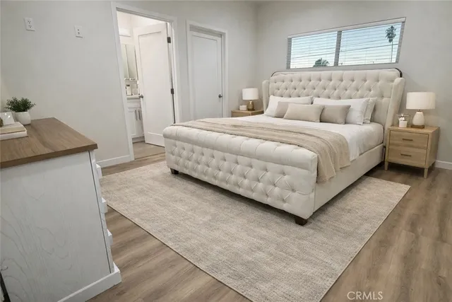 a bedroom with a bed and a table