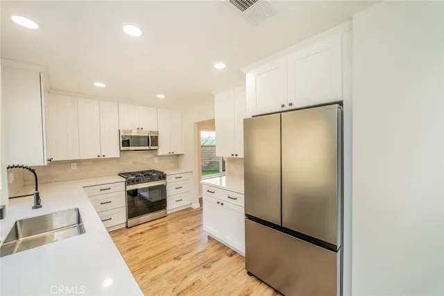 a living room with furniture and flat screen tv
