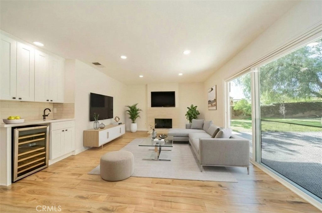 3 Wild W Circle Phillips Ranch, CA 91766 - Photo 16 of 65 a living room with furniture and flat screen tv