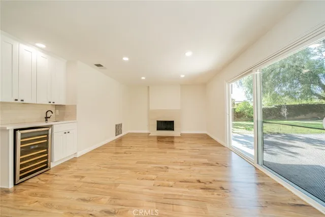 a bathroom with a granite countertop toilet sink and mirror