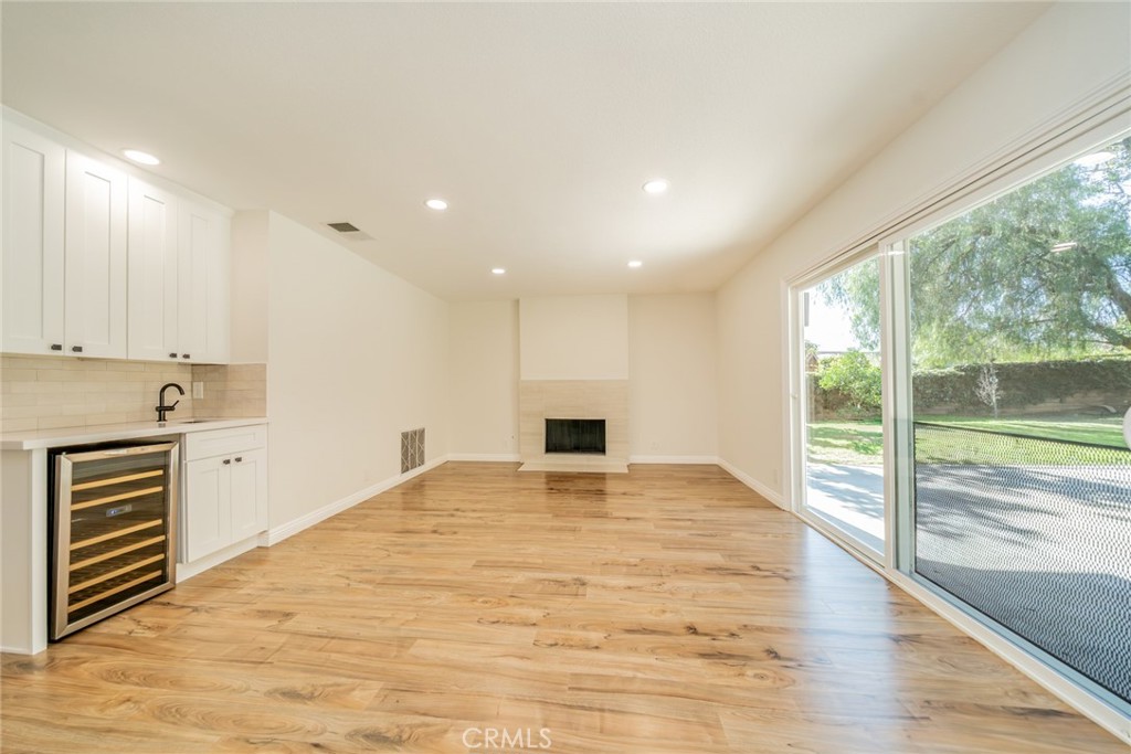 3 Wild W Circle Phillips Ranch, CA 91766 - Photo 17 of 65 a view of an empty room with a window and kitchen view