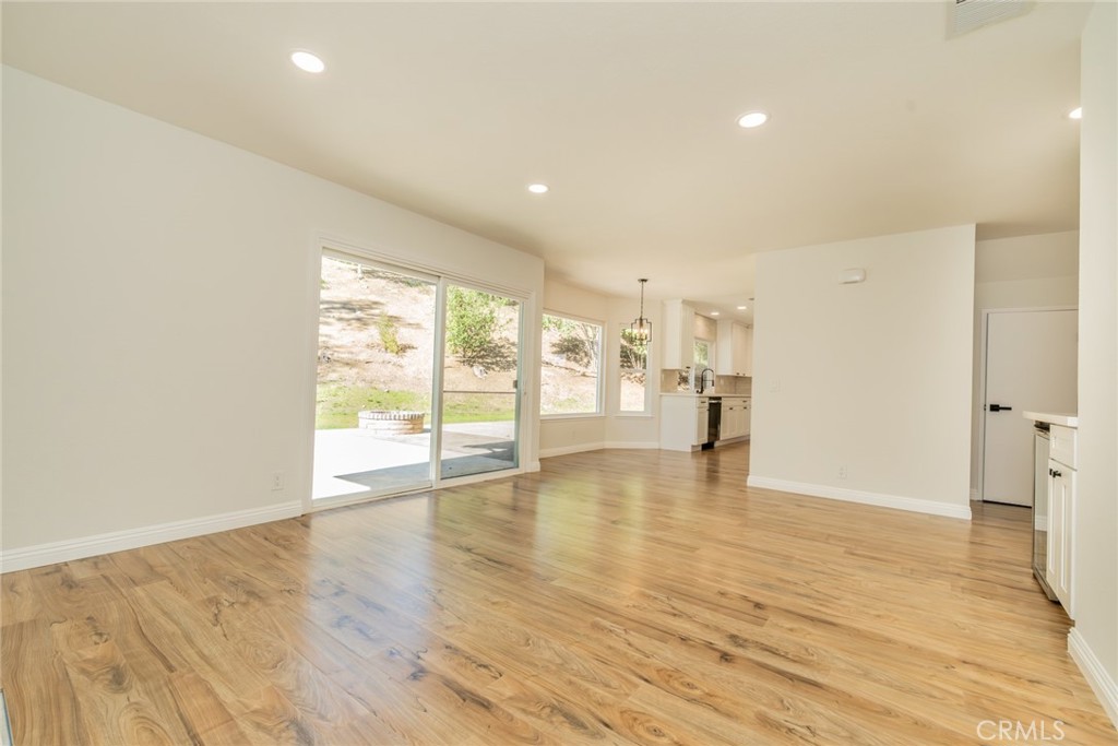 3 Wild W Circle Phillips Ranch, CA 91766 - Photo 19 of 65 a view of an empty room with wooden floor and a window