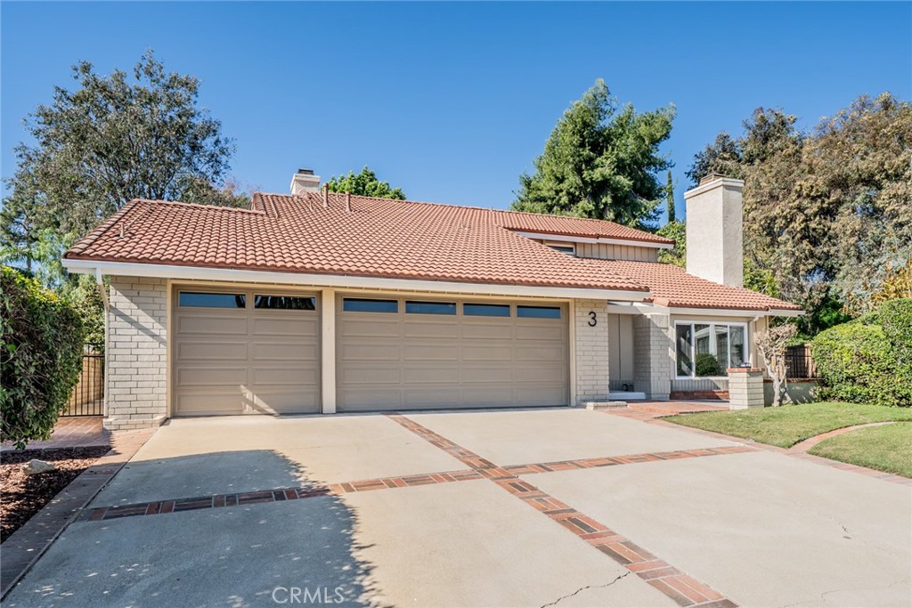 3 Wild W Circle Phillips Ranch, CA 91766 - Photo 2 of 65 a front view of a house with a garden