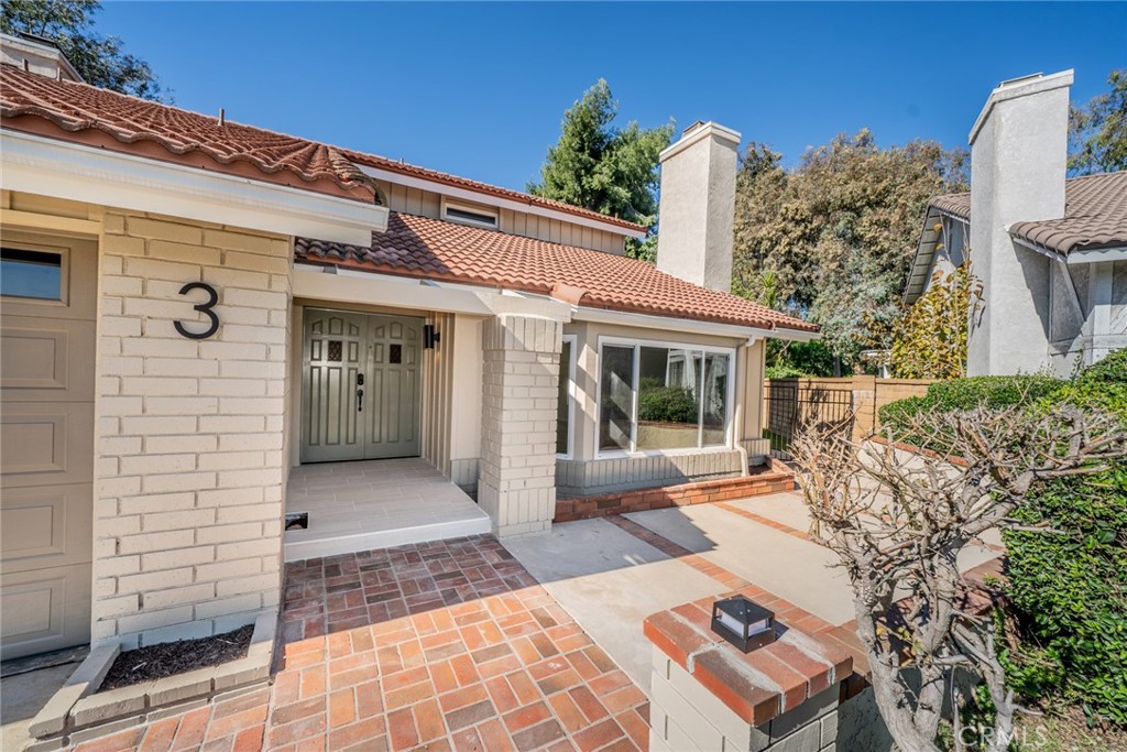3 Wild W Circle Phillips Ranch, CA 91766 - Photo 3 of 65 a view of a patio with a table and chairs and potted plants