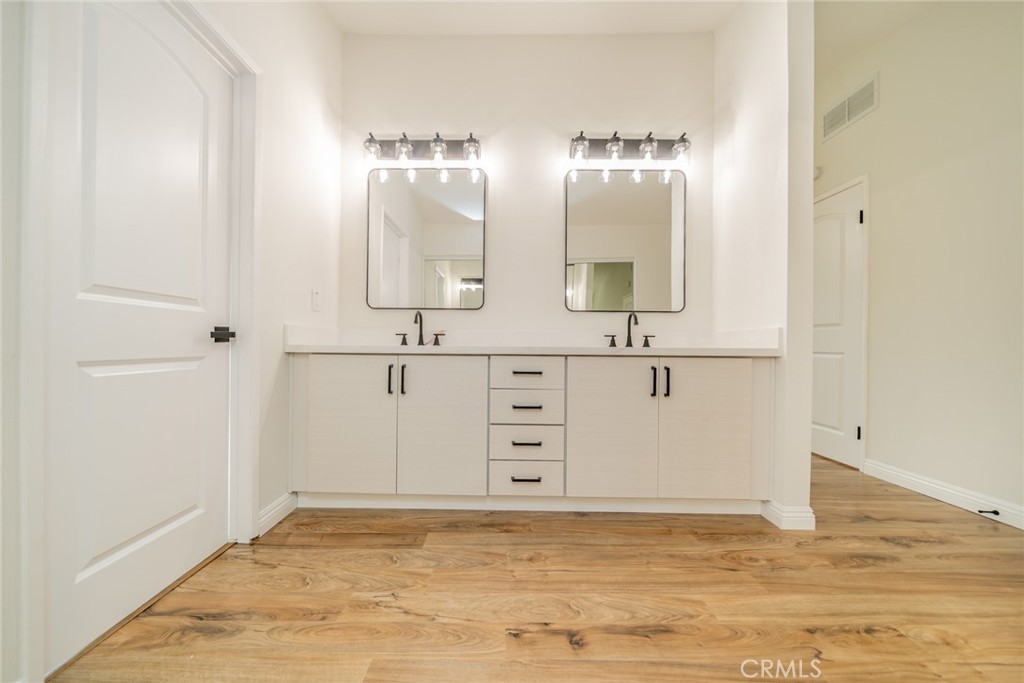 3 Wild W Circle Phillips Ranch, CA 91766 - Photo 32 of 65 a bathroom with a sink and a mirror