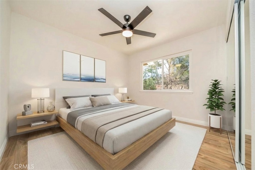 3 Wild W Circle Phillips Ranch, CA 91766 - Photo 35 of 65 a bedroom with a large bed and a large window