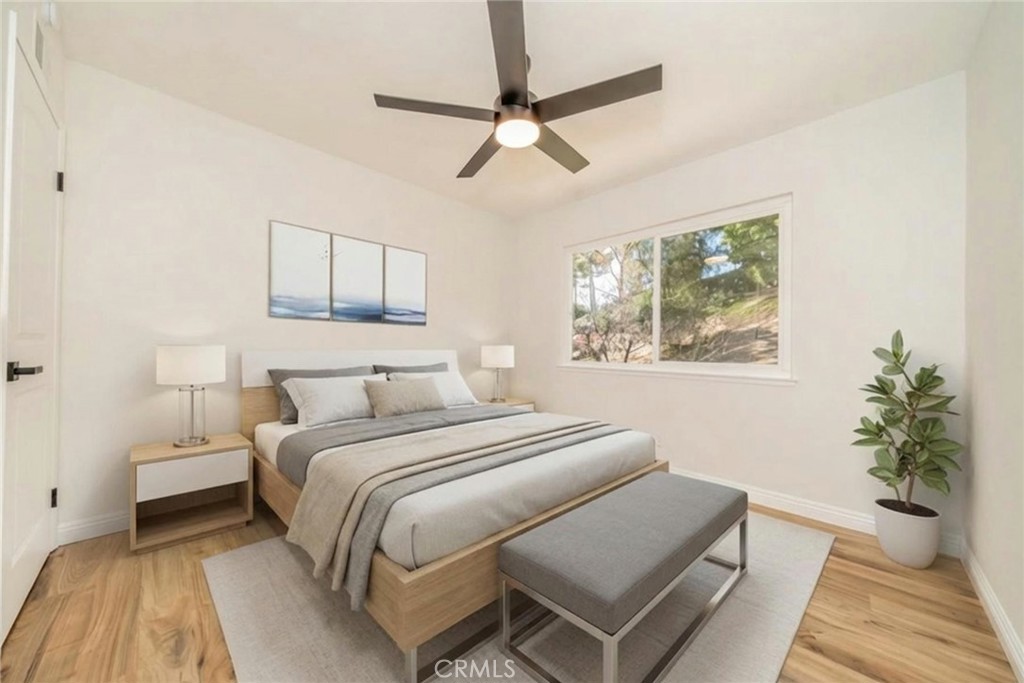 3 Wild W Circle Phillips Ranch, CA 91766 - Photo 42 of 65 a bedroom with a bed and a potted plant