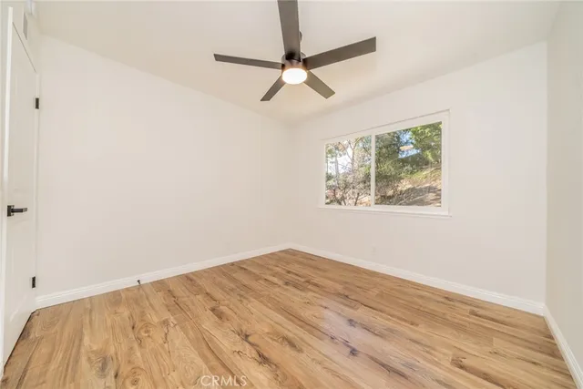 a view of a room with wooden walls