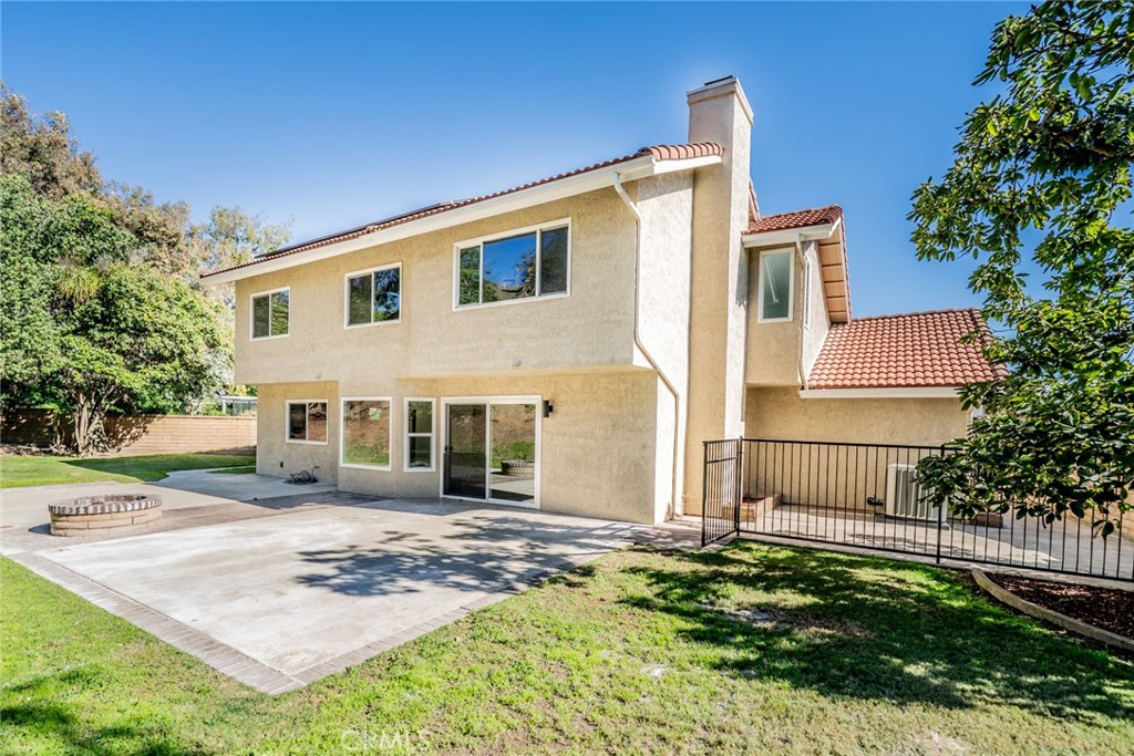 3 Wild W Circle Phillips Ranch, CA 91766 - Photo 46 of 65 a front view of a house with garden