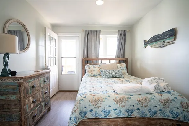 a bedroom with a bed and a dresser