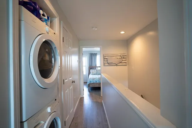 a view of a hallway with washer and dryer