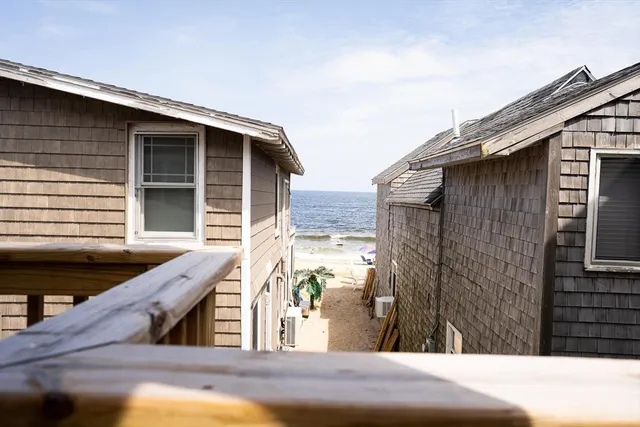 a view of house with wooden stairs