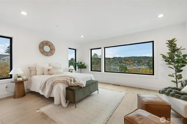 a bedroom with a bed and glass window