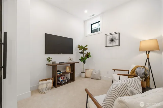 a view of a room with a furniture and front door
