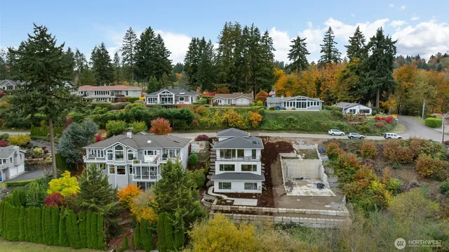an aerial view of a house with a garden and trees