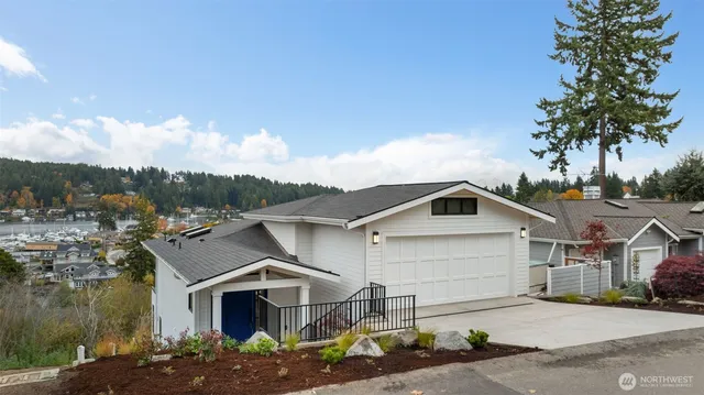 a view of lake with lots of residential buildings in background