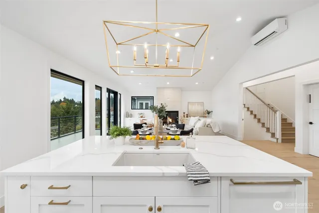 a view of living room with furniture and chandelier