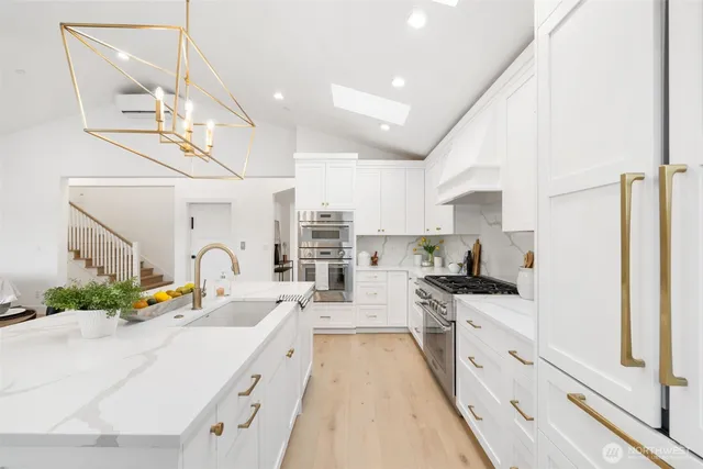 a view of living room with furniture and chandelier