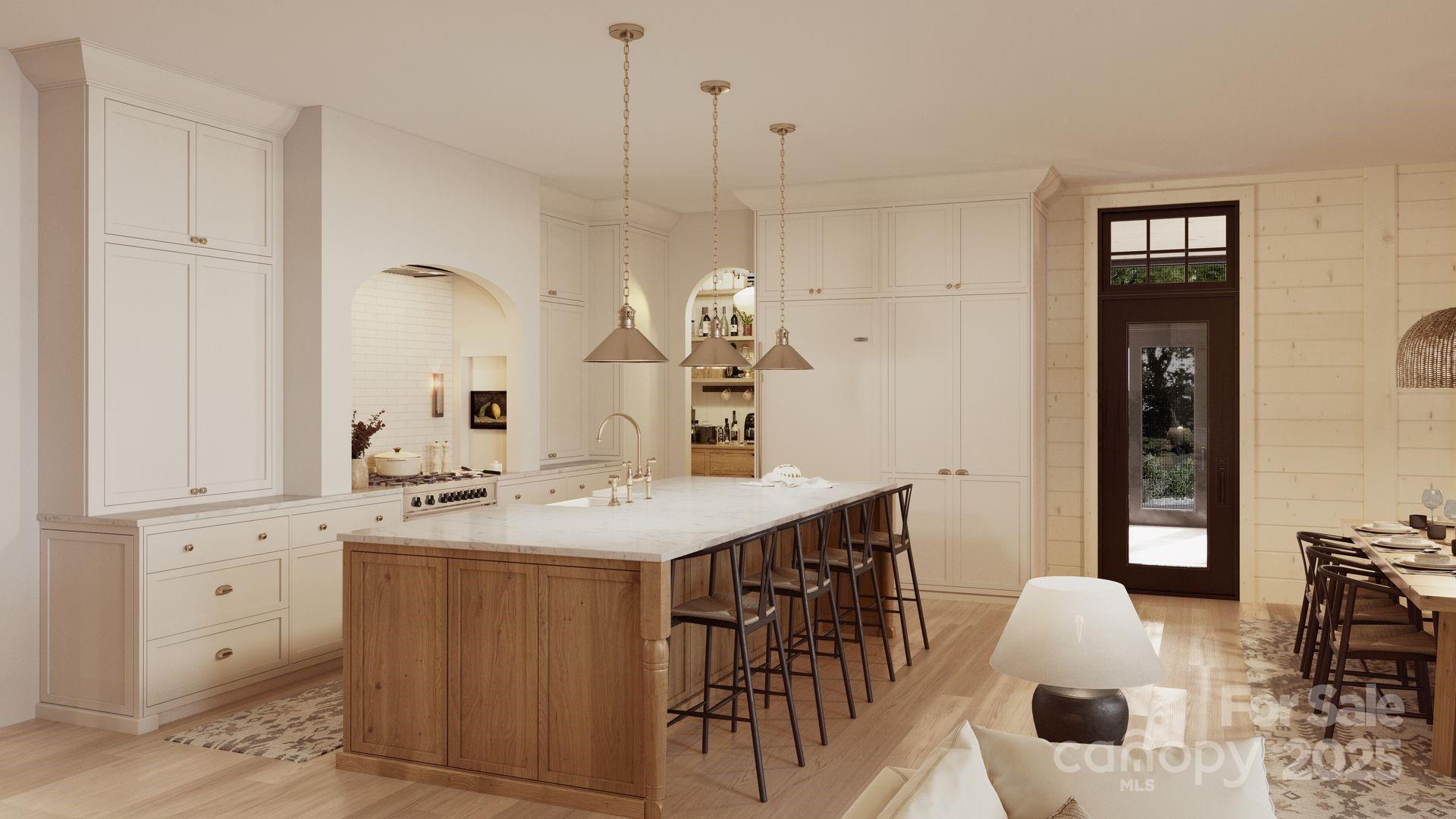 2109 Inlt Shr Road Northeast Connelly Springs, NC 28612 - Photo 9 of 34 a kitchen with a table chairs and white cabinets