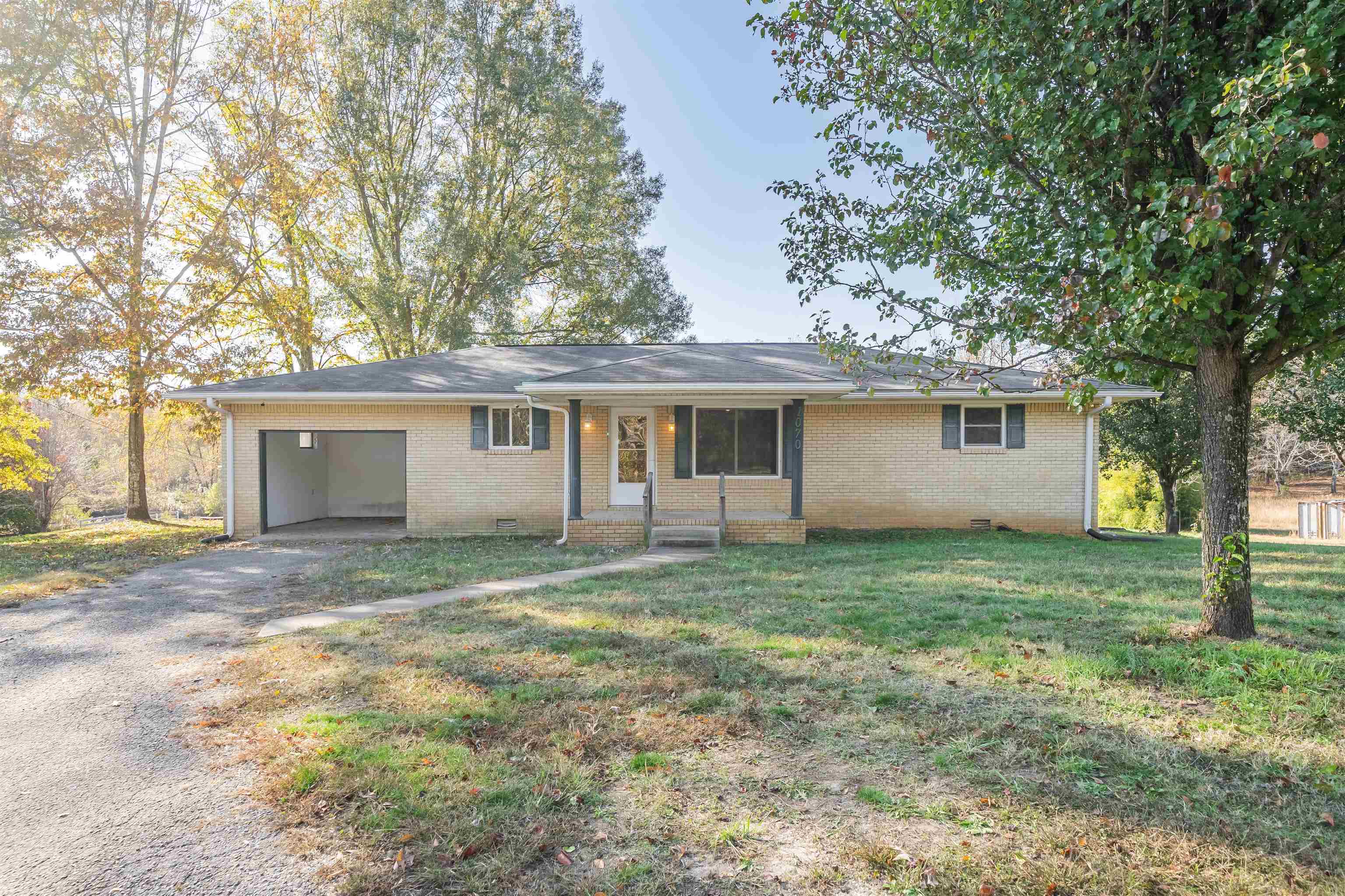 1070 Pine Top Road Toone, TN 38381 - Photo 1 of 30 front view of a house and a yard