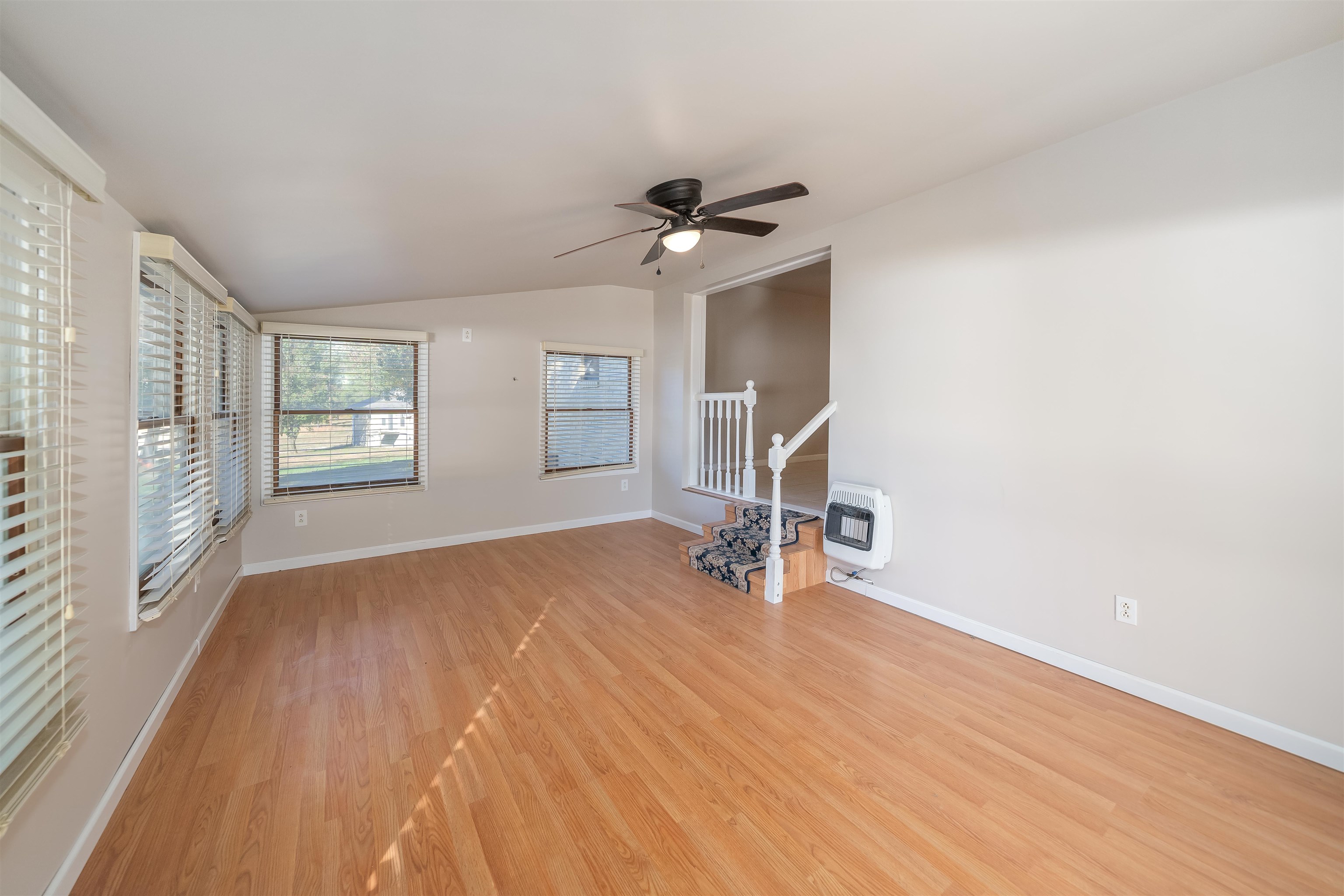 1070 Pine Top Road Toone, TN 38381 - Photo 12 of 30 wooden floor in an empty room with a window