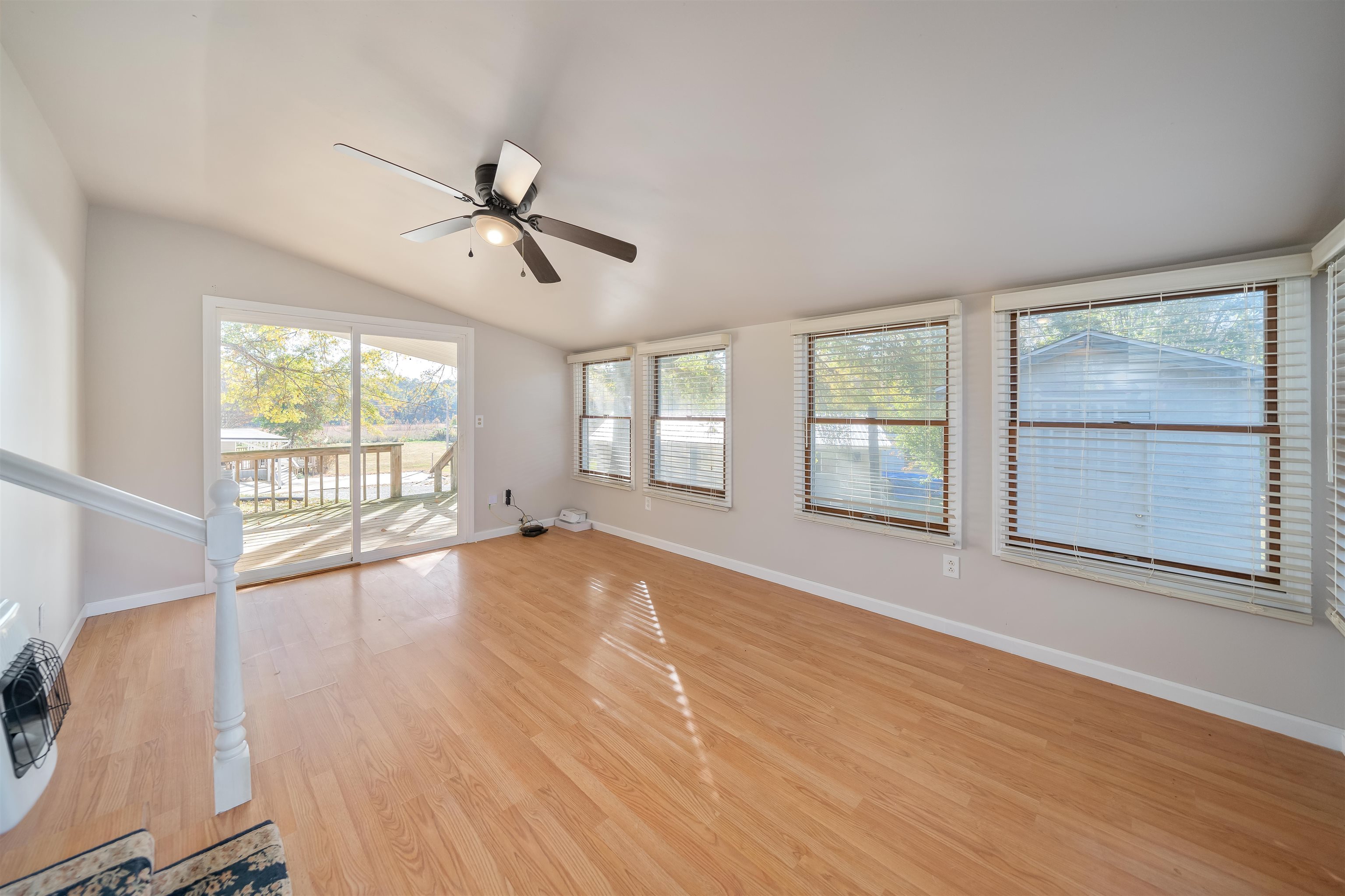 1070 Pine Top Road Toone, TN 38381 - Photo 13 of 30 a view of an empty room with a window and wooden floor