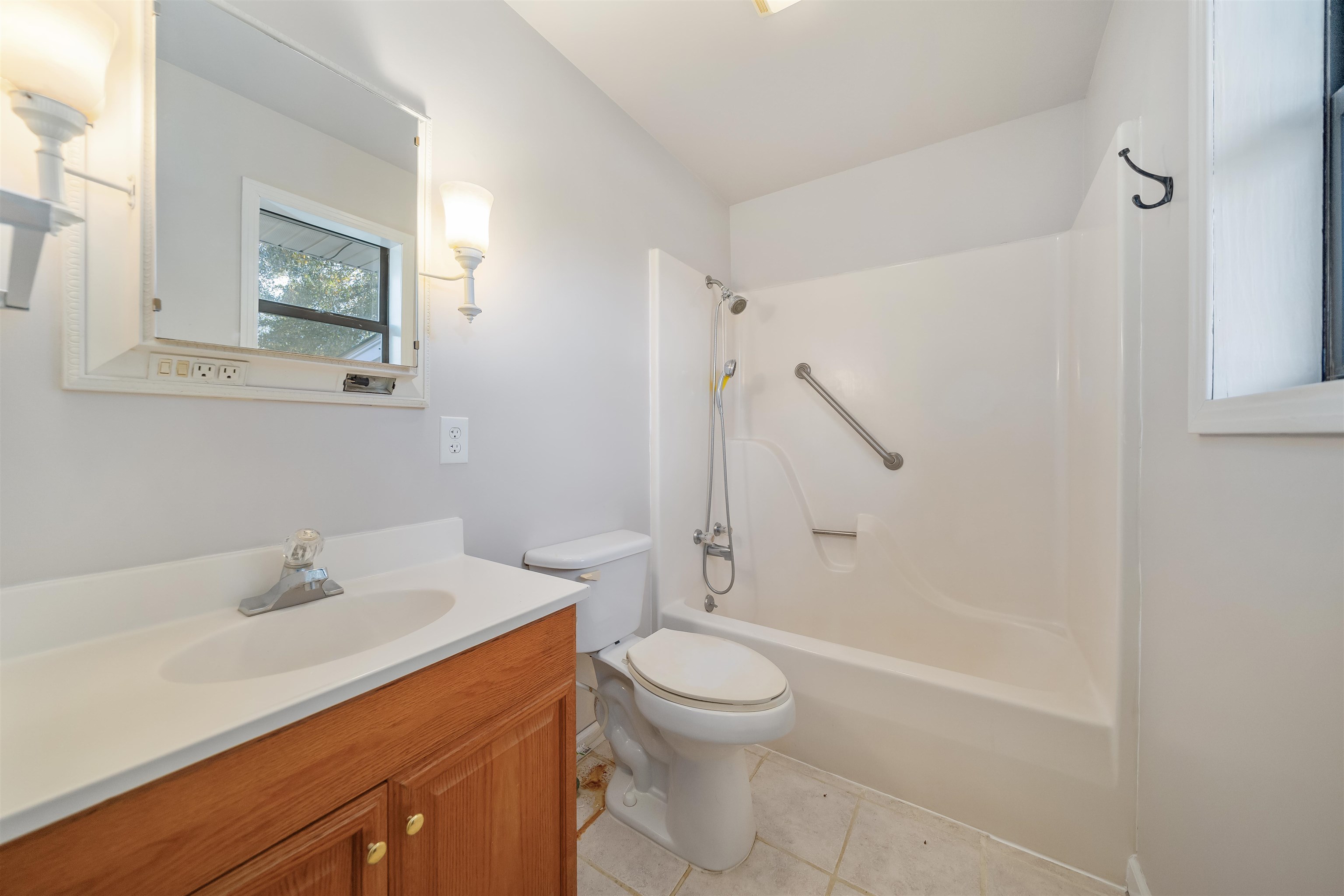 1070 Pine Top Road Toone, TN 38381 - Photo 19 of 30 a bathroom with a sink a toilet and shower