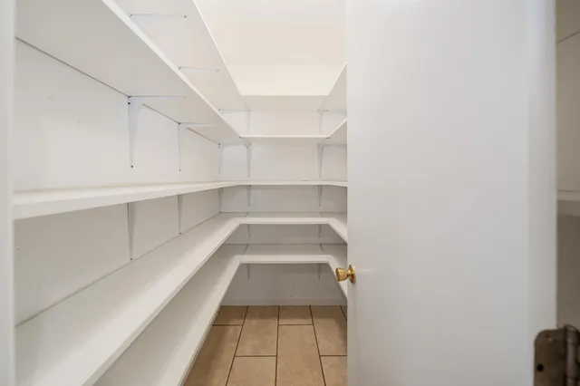 a white refrigerator freezer sitting inside of a kitchen
