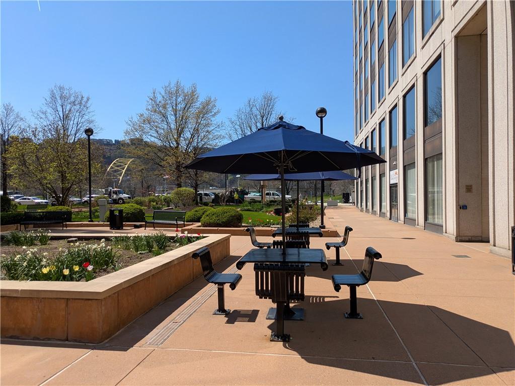 320 Fort Duquesne Boulevard, Unit 24M Pittsburgh, PA 15222 - Photo 32 of 40 a view of chairs and tables in the patio